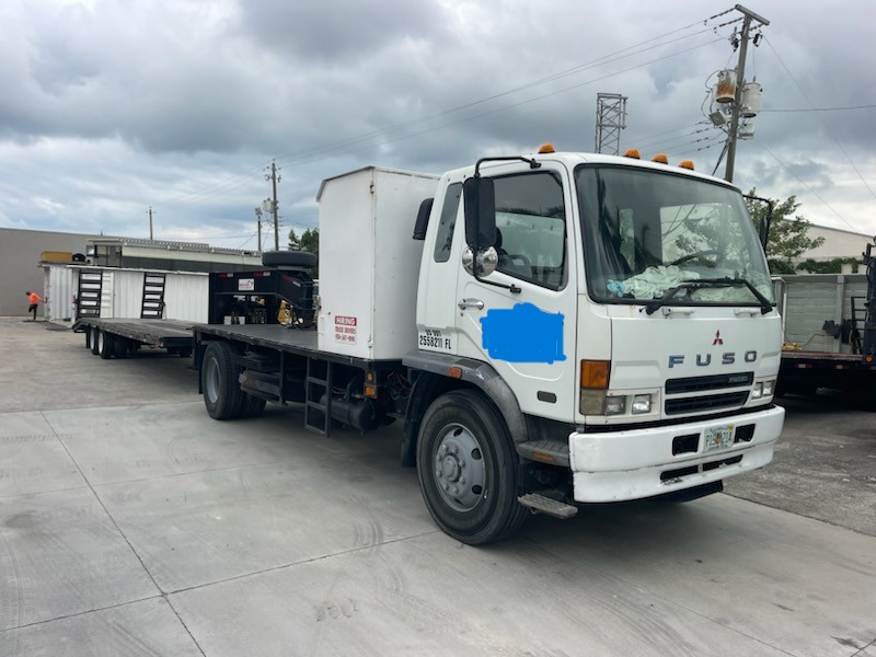 2007 Mitsubishi FM 330 with, 2022 Hooper Equipment Trailer, 22.5 Ton, Gooseneck and 2006 PJ Dump Hurricane Clean Up Trailer, 10 Ton, Gooseneck.