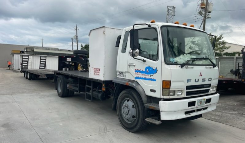 2007 Mitsubishi FM 330 with, 2022 Hooper Equipment Trailer, 22.5 Ton, Gooseneck and 2006 PJ Dump Hurricane Clean Up Trailer, 10 Ton, Gooseneck. full